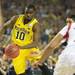 Michigan junior Tim Hardaway Jr. dribbles the ball past Louisville traffic during the second half of the national championship game at the Georgia Dome in Atlanta on Monday, April 8, 2013. Melanie Maxwell I AnnArbor.com